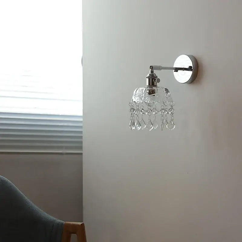 Modern chrome crystal led wall light featuring a clear crystal chandelier sconce with polished chrome finish and glass beads
