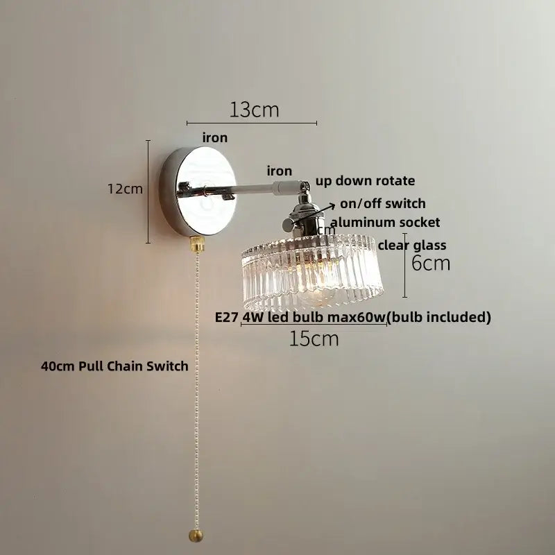 A sleek chrome crystal led wall light with a clear glass chandelier shade and adjustable arm for modern bedroom decorbites crystal led