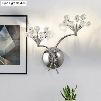 Modern chrome crystal orb light fixture with two branching arms and clear globes direct wired electric wall sconce