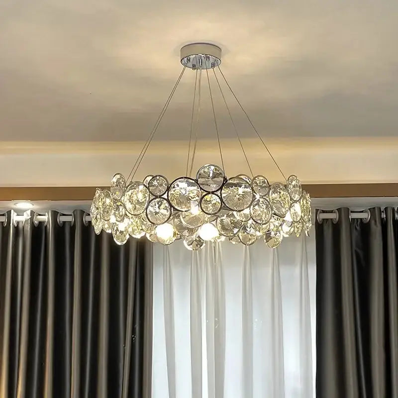 Modern chrome crystal ring chandelier with clear glass orbs suspended by thin wires for dining room decorbites crystal ring