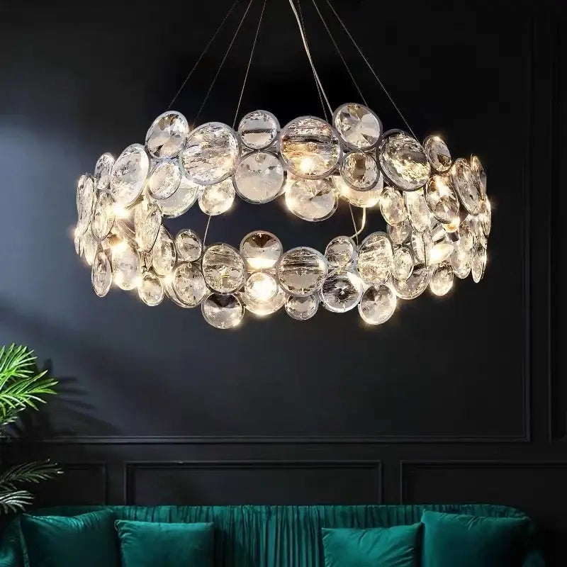 A modern chrome crystal ring chandelier with clear faceted glass discs in overlapping layers for dining room decorbites crystal ring