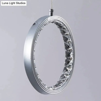 Silver oval pendant light with sleek metallic frame and embedded crystal rings led for bedroom and dining room decor