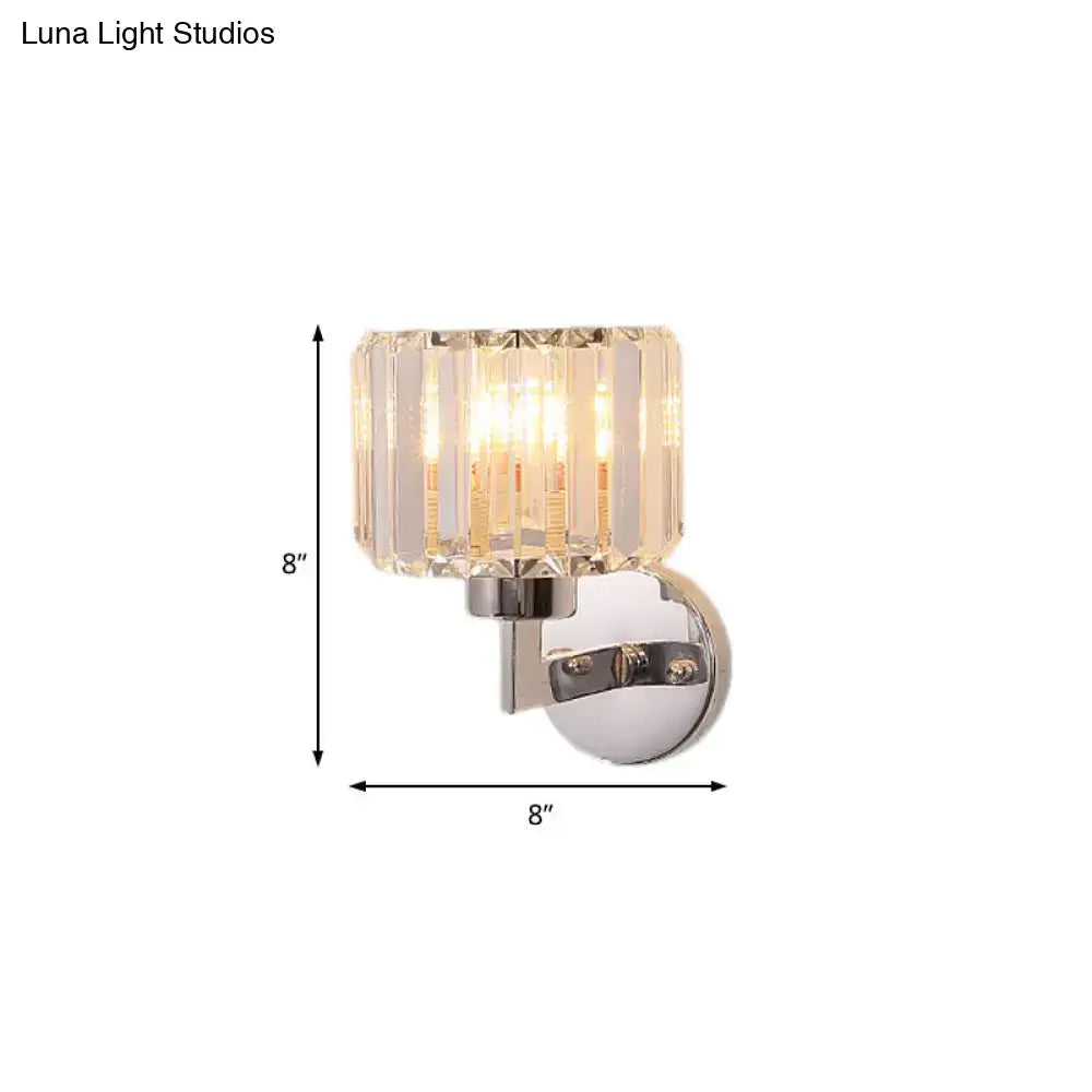 Modern chrome crystal sconce light featuring a clear faceted glass shade with polished chrome wall sconce mounting bracket