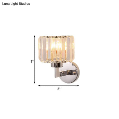 Modern chrome crystal sconce light featuring a clear faceted glass shade with polished chrome wall sconce mounting bracket