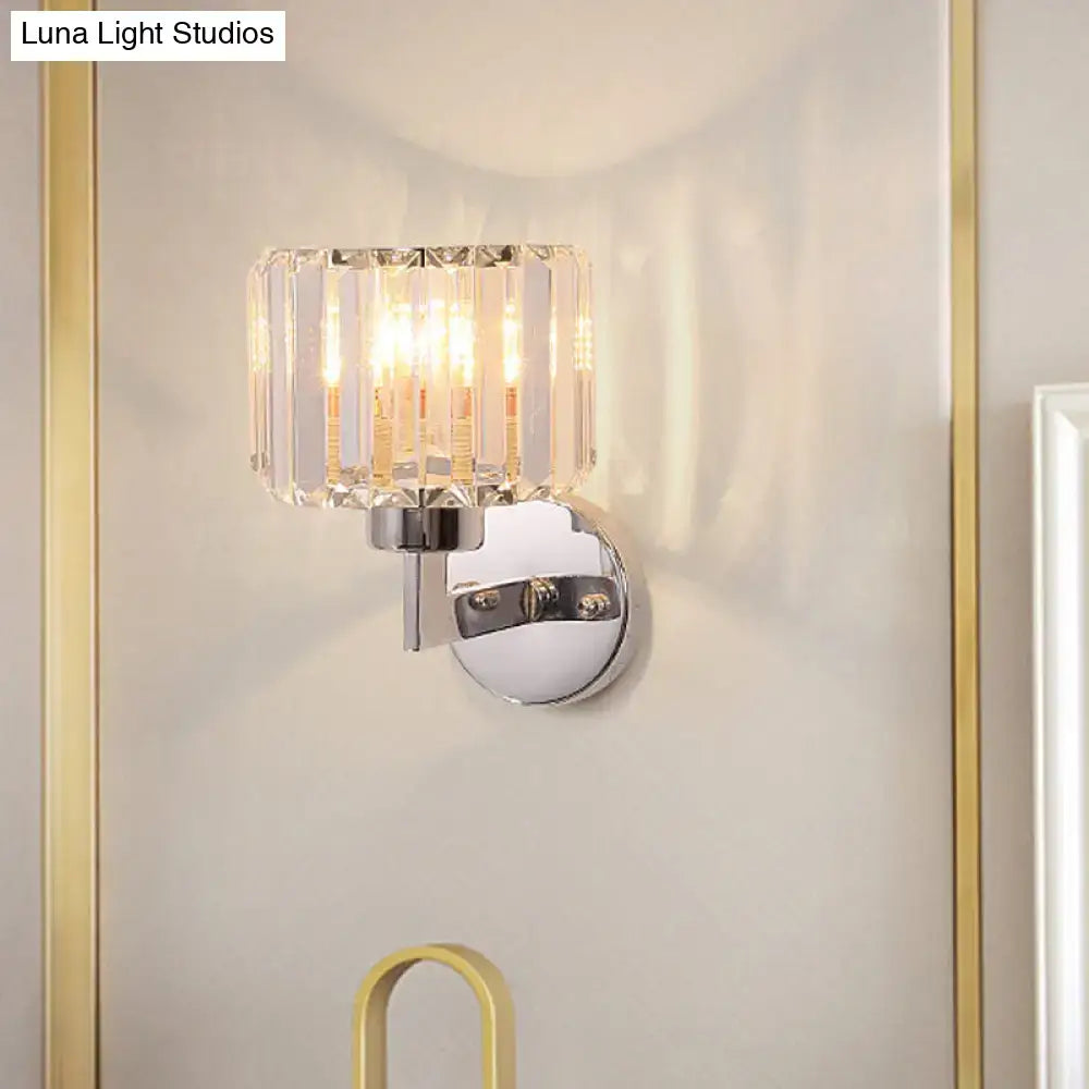 Modern chrome crystal sconce light with cylindrical vertically faceted crystal shade for hallway wall sconce light