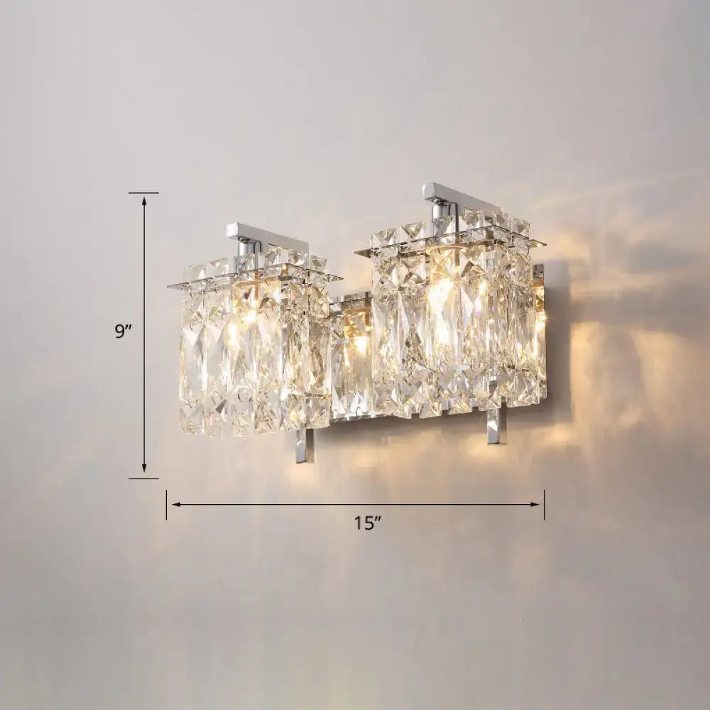 Modern chrome crystal shade sconce light with crystal-encrusted wall mount and two illuminated faceted glass panels