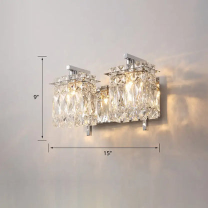 Modern chrome crystal shade sconce light with crystal-encrusted wall mount and two illuminated faceted glass panels