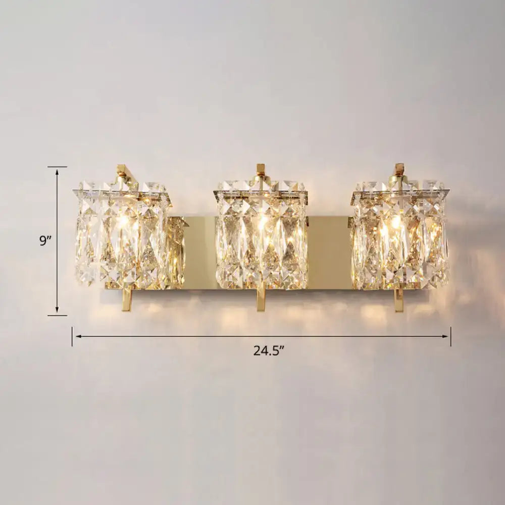 Gold-toned modern wall mount sconce light with three crystal shade fixtures for bedroom illumination