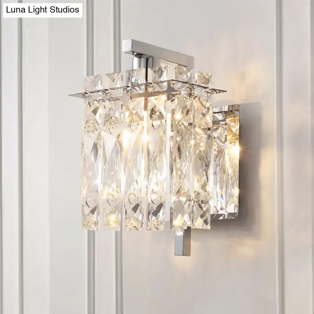Modern chrome crystal shade sconce light featuring a wall mount with faceted clear crystals and sleek frame