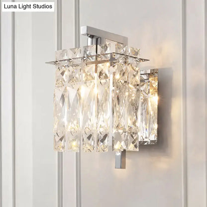 Modern chrome crystal shade sconce light featuring a wall mount with faceted clear crystals and sleek frame