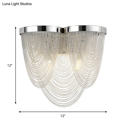 Modern chrome crystal tassel wall lamp with cascading silver crystals and polished chrome frame for living room use