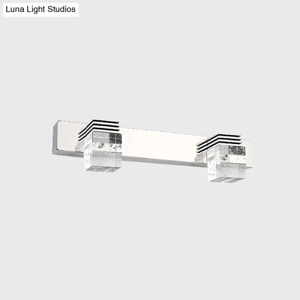 Modern chrome vanity light fixture with two clear crystal cube accents featuring black horizontal stripes wall mounted