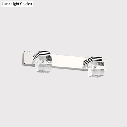 Modern chrome vanity light fixture with two clear crystal cube accents featuring black horizontal stripes wall mounted