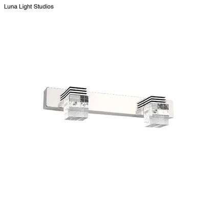 Modern chrome crystal vanity light fixture with two clear cube-shaped led lights and black horizontal stripe accents