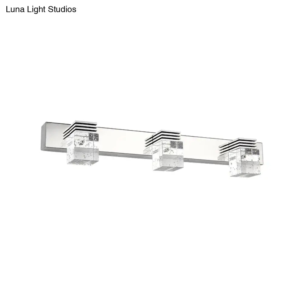 Modern chrome crystal vanity light fixture with three clear cube bulbs featuring black horizontal stripes for bathroom use