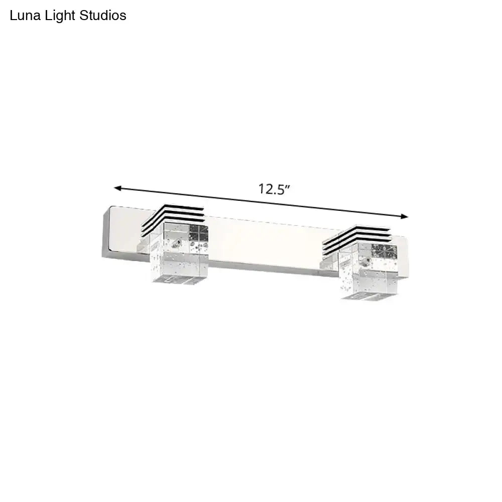 Modern chrome crystal vanity light fixture with clear crystal accents and sleek rectangular design for bathroom walls
