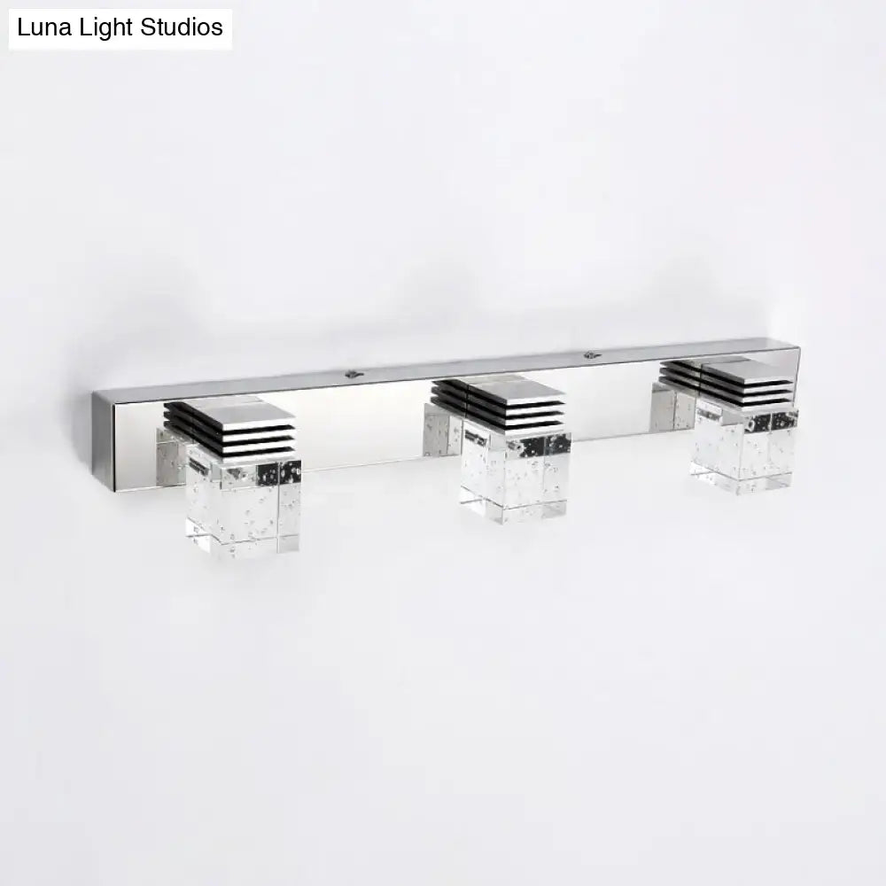 Modern chrome crystal vanity light fixture with three sleek geometric lights for bathroom wall installation