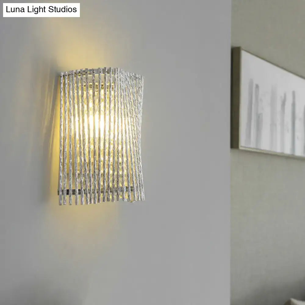 Silver textured glass wall lamp with vertical ridged panels and crystal beaded strand wall mount for bedroom use