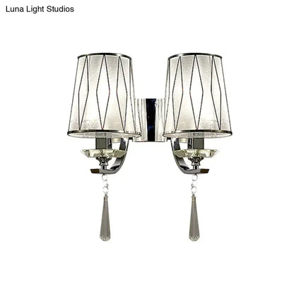 Modern chrome double-arm wall lighting fixture with frosted glass shades geometric wire and crystal teardrop pendants