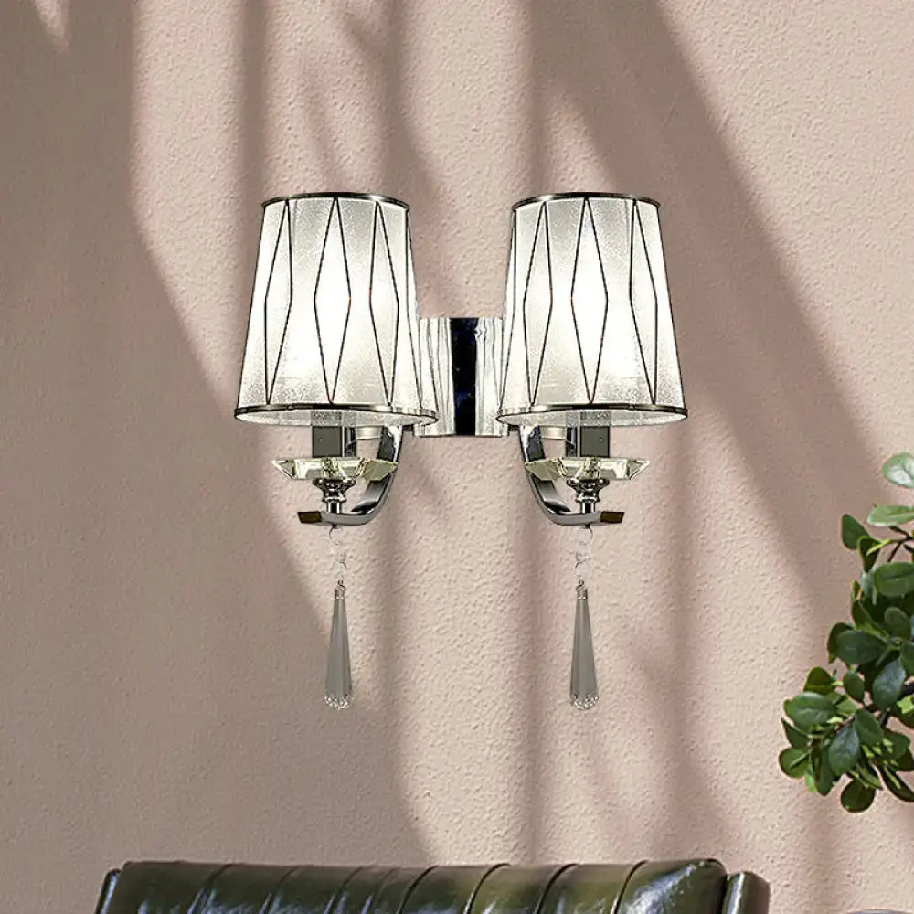 Modern chrome wall lighting fixture with double arms frosted glass shades geometric black lines and crystal pendants