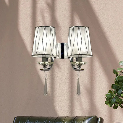 Modern chrome wall lighting fixture with double arms frosted glass shades geometric black lines and crystal pendants