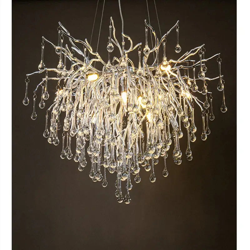 Modern chrome crystal water drop branch chandelier with delicate transparent arms and teardrop glass elements for living room lighting