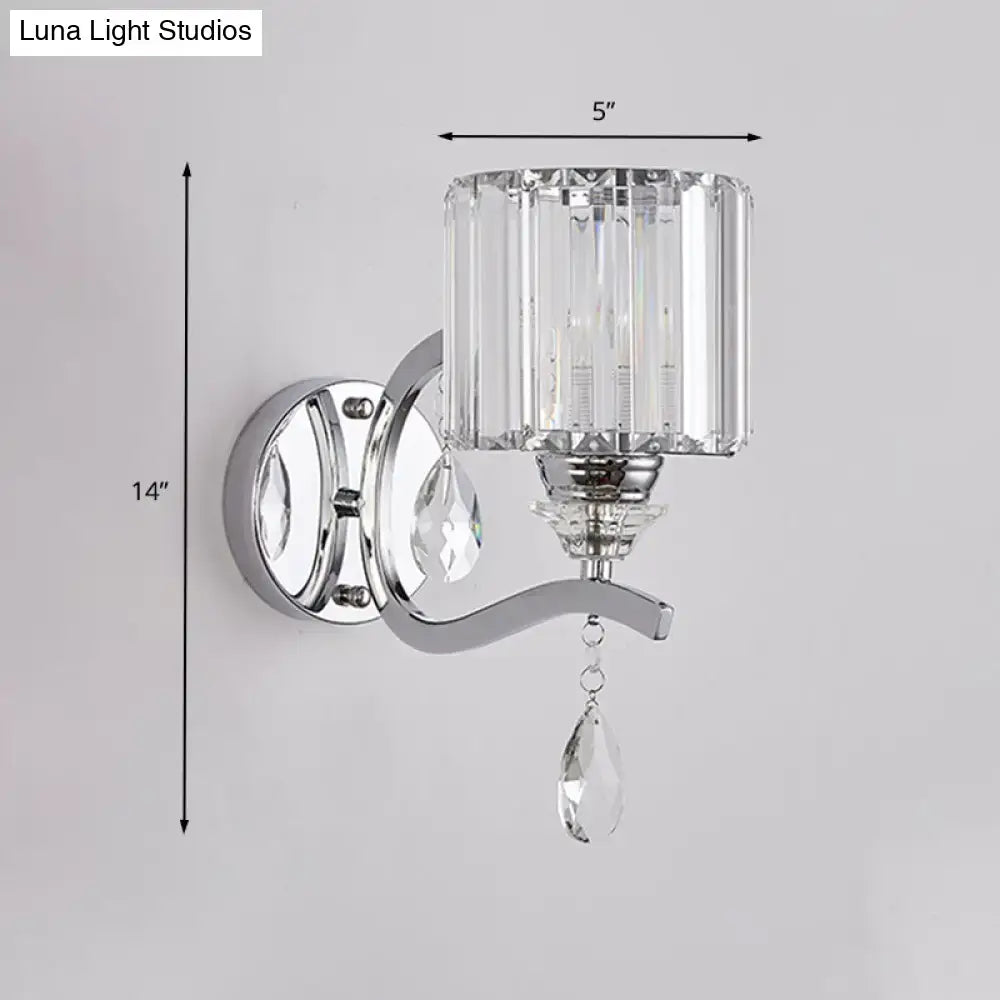 Modern chrome cylinder wall light with faceted crystal block shade and dangling teardrop crystals for bedroom use