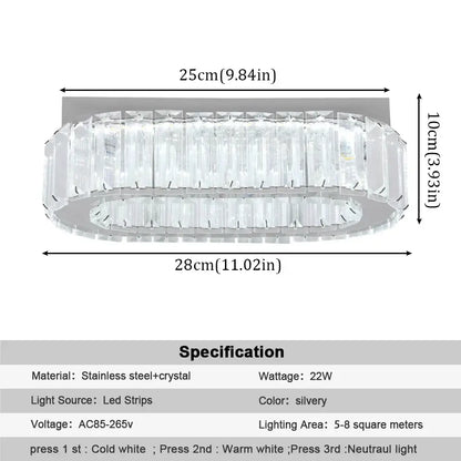 A modern oval decorbites crystal ceiling chandelier with silver chrome finish and clear crystal accents for living room