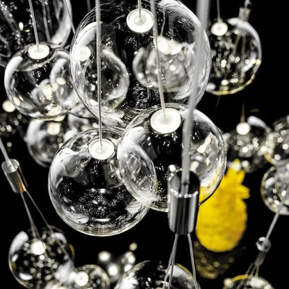 Modern chrome decorbites glass ball pendant light featuring clear glass globes and metallic fixtures for living room use