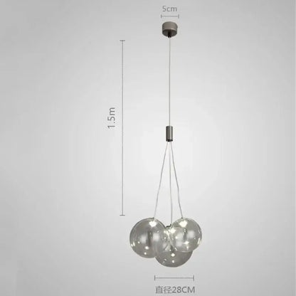 Modern chrome decorbites glass ball pendant light with three clear glass spheres and sleek metallic fixture for living room