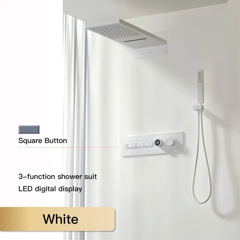 White square button with led digital display on a modern chrome rainfall shower system with 3-function controls
