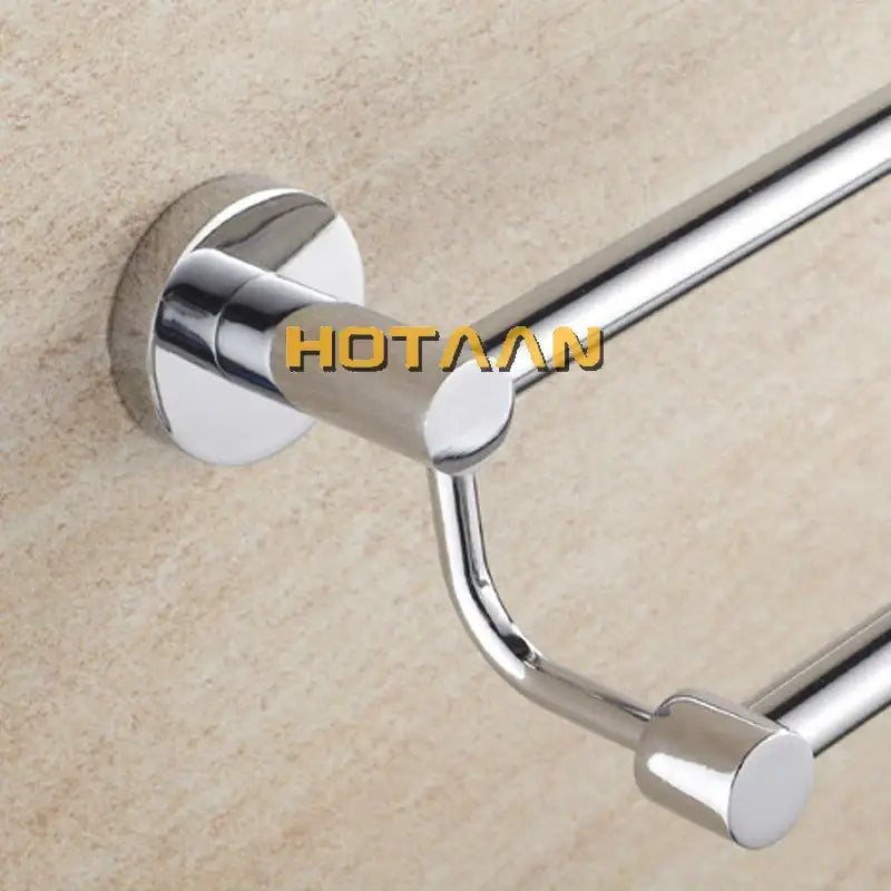 Modern chrome double towel bar with sleek polished metal bars and circular wall-mounted base for bathroom use
