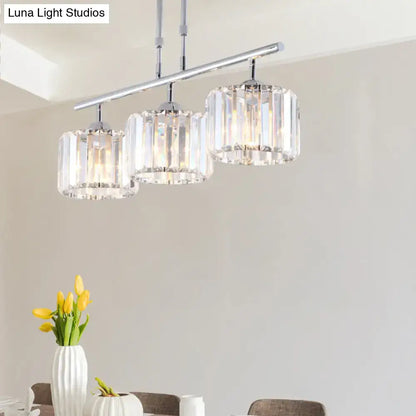 Modern chrome drum pendant light with three cylindrical crystal shades designed for bedroom use