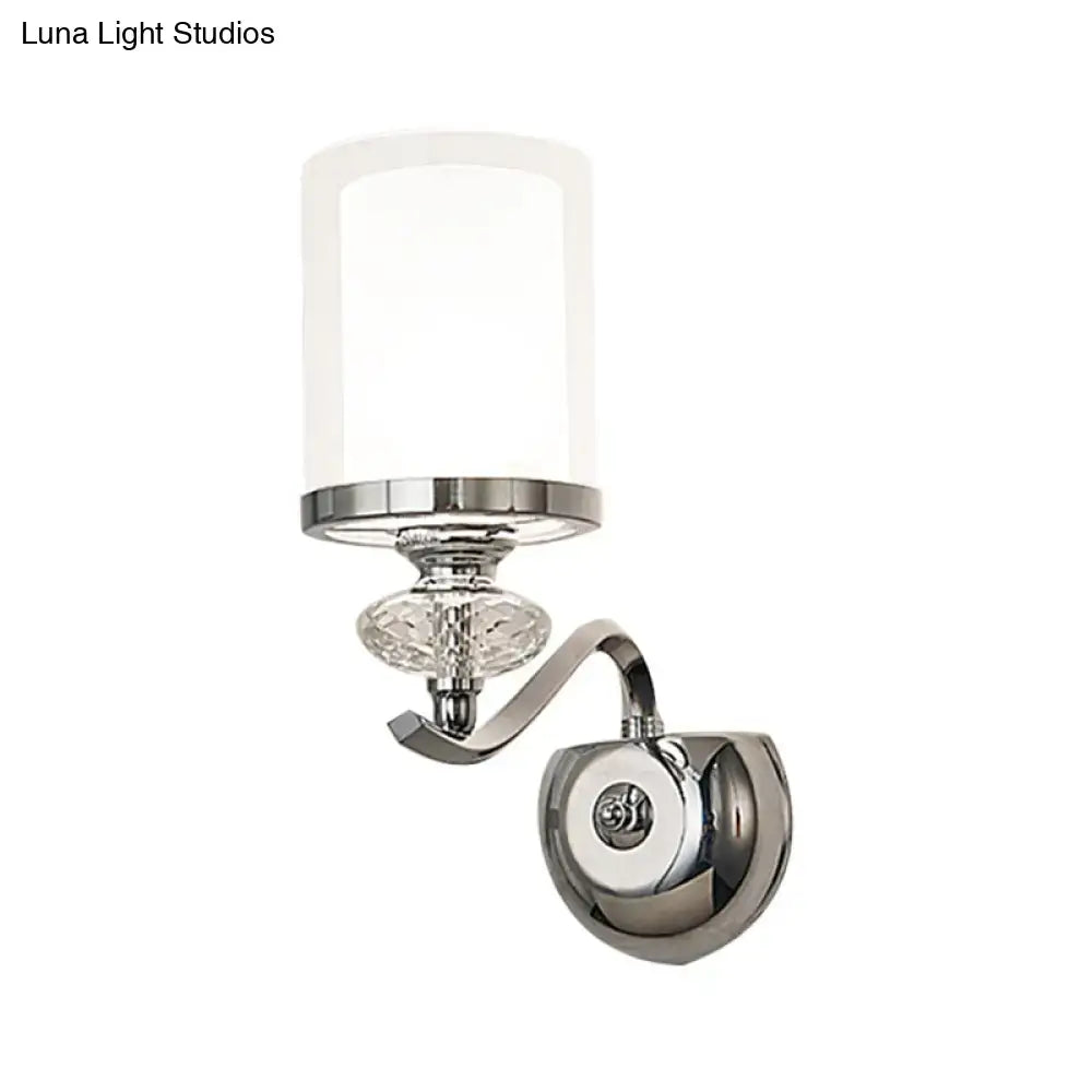 Modern chrome dual cylinder bathroom sconce with frosted glass shade, crystal accent, and curvy arm fixture height detail