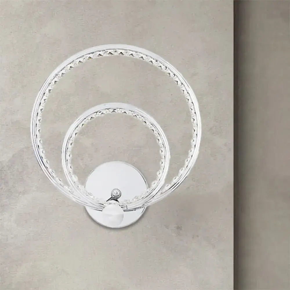 Modern chrome dual ring led wall mounted light with clear glass vase and crystal embellishments on polished base
