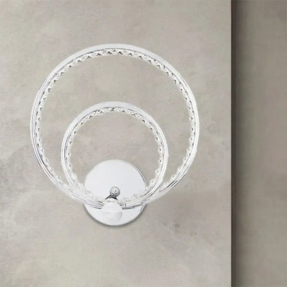 Modern chrome dual ring led wall mounted light with clear glass vase and crystal embellishments on polished base