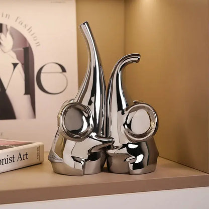 Modern chrome elephant sculpture ceramic bookends with shiny chrome finish and sleek design for living room decorbites elephant decor