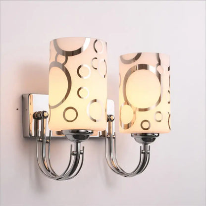 Modern chrome finish abstract glass wall sconce with two frosted glass shades and gold circle pattern 110v-120v