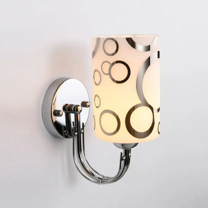 Modern chrome finish wall sconce with cylindrical frosted glass shade featuring abstract brown and silver circles 110v-120v
