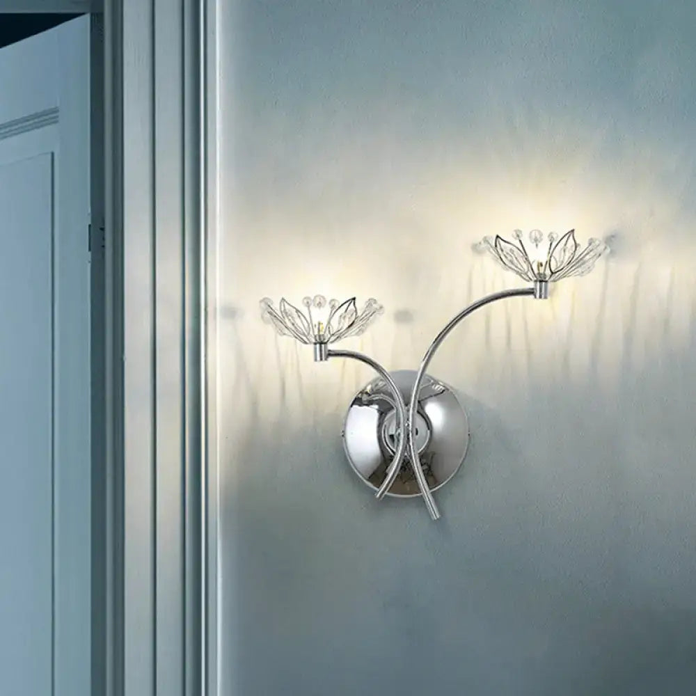 Modern chrome flower wall lamp with two crystal-accented arms, suitable as a 110v-120v bedroom wall light