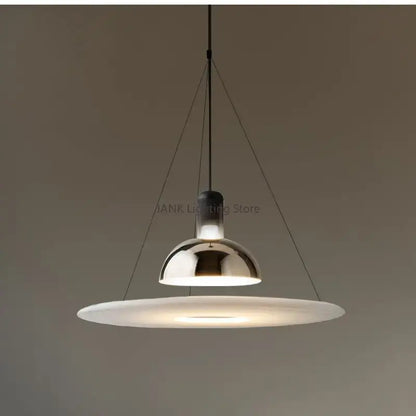 Modern chrome flying saucer chandelier with a sleek dome and wide frosted glass diffuser for living room lighting