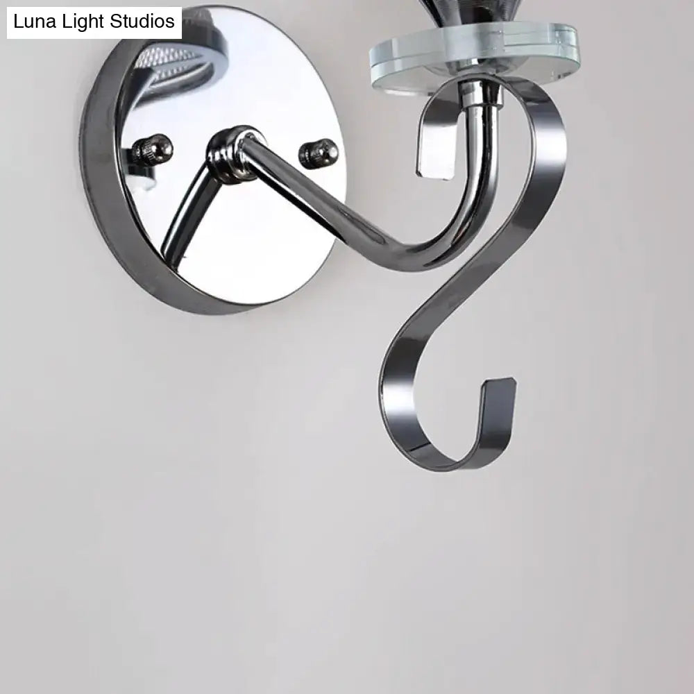 Modern chrome frosted glass wall light fixture with sleek curved arm and glass accent for bedroom lighting needs