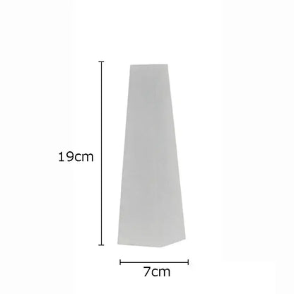 A sleek matte white tapered planter 19cm high by 7cm wide complements decorbites geometric crystal artwork polyhedron bookends