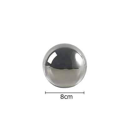 Modern chrome geometric crystal artwork polyhedron bookend featuring an 8cm polished metallic sphere with reflective chrome finish