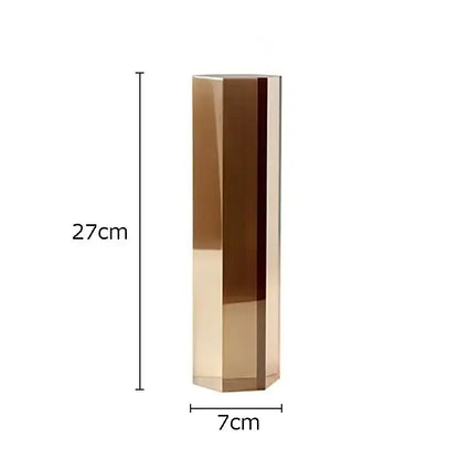 A sleek 27cm tall gold hexagonal vase with polished facets as decorbites geometric crystal artwork polyhedron decor