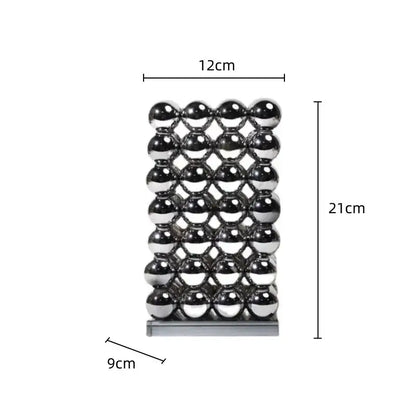 A modern chrome geometric crystal ball sculpture made of polished spheres in a 12cm by 21cm grid pattern