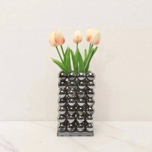 A modern chrome geometric crystal ball glass vase made of reflective spheres for living room decor