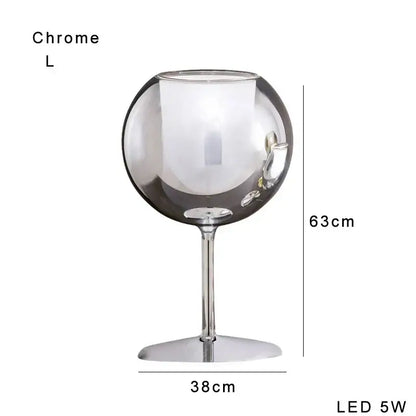 Modern chrome glass gold table lamp with a sleek reflective surface and slender stem ideal for living room decorbites glass gold
