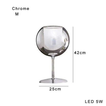 Modern chrome glass gold table lamp with a sleek reflective surface and slender stem for luxury living room decorbites glass gold