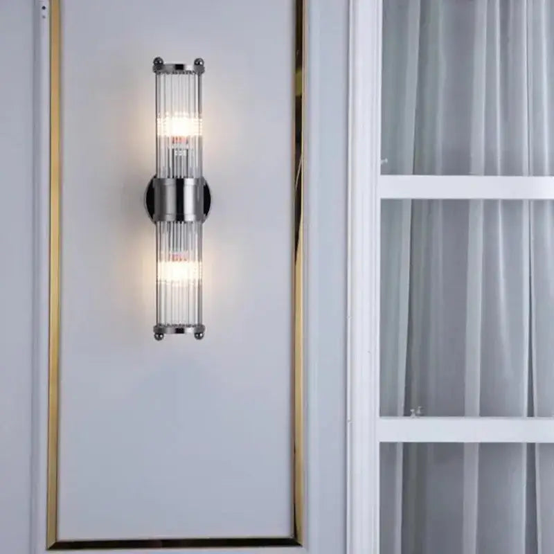 Modern chrome glass rod wall sconce with vertical rods and minimalist design for bathroom vanity lights